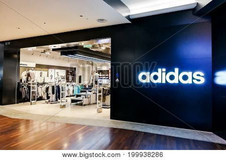 KUALA LUMPUR Malaysia June 25 2017: Adidas AG is a German multinational corporation headquartered in Herzogenaurach Germany that designs and manufactures shoes clothing and accessories. Picture here is the outlet at Mid Valley Mega Mall, Kuala Lumpur.