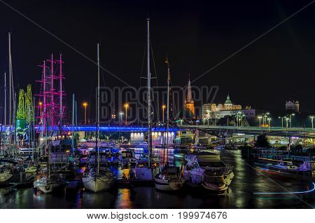 MARINA AT NIGHT - Yachts and sailing ship Mir moored at the wharf of the marina in Szczecin