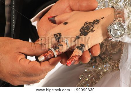 a groom gives a ring for a bride