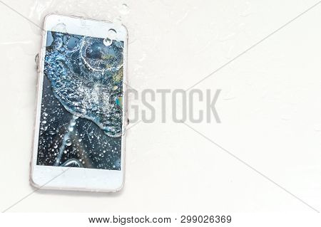 Mobile Phone Dropped Into The Water In The Bathroom