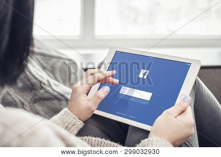 Kiev, Ukrain - February 10, 2018: Woman Using Facebook App On A Brand New Apple Ipad Pro Silver, 7th