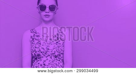 Duo Tone Portrait Of Young Beauty Woman In Glasses And Sress Purple