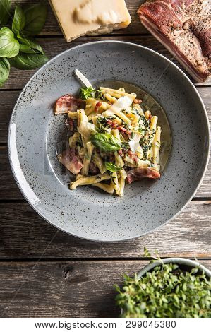Pasta Casarecce With Bacon Pancetta Parmesan Cheese And Herbs Basil. Italian Or Mediterranean Cuisin