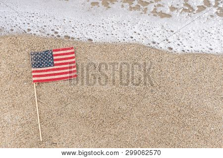 Patriotic Usa Background With Flag On The Sandy Beach