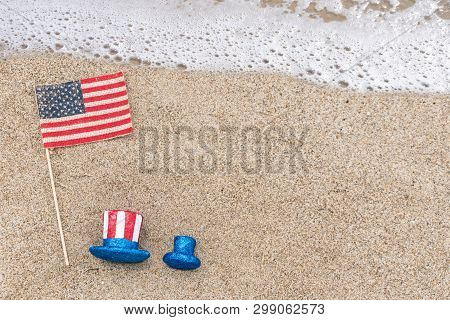 Patriotic Usa Background With Flags And Decorations On The Sandy Beach