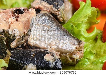 Macro Shot. Pieces Of Sardine Iwashi On Lettuce Leaves.
