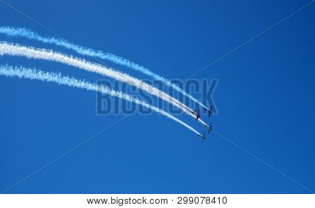 Torre Del Mar, Spain - July 29, 2018. Aircrafts Aerobatic Group Performing A Demonstration Flight At