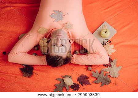 Funny Man In Suit Resting With Leaf Lies On Wooden Floor In Autumn Leaves. Sale For Entire Autumn Co