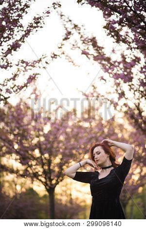 Happy Young Travel Dancer Woman Enjoying Free Time In A Sakura Cherry Blossom Park - Caucasian White