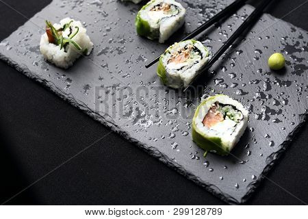 Sushi. Sushi Roll With Salmon, Cucumber, Cheese, Kampyo And Avocado Slices.