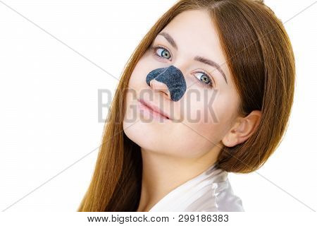 Woman Appying Clear-up Strips On Nose, Using Pore Cleansing Textile Mask, Against White. Girl Taking