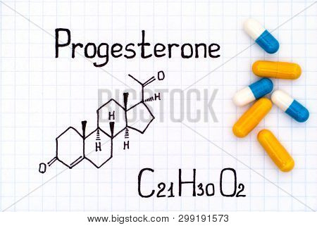 Chemical Formula Of Progesterone With Some Pills. Close-up.