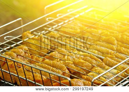 Cubes Of Pickled Meat In A Grill Grate At Brazier. Barbecue Kebab On Embers Outdors. Grilled Picnic