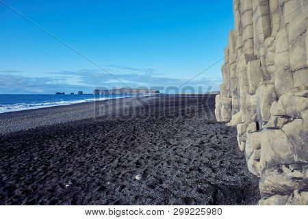 Coast Of The Atlantic Ocean With Black Sand In Iceland. The Reynisfjara Beach.