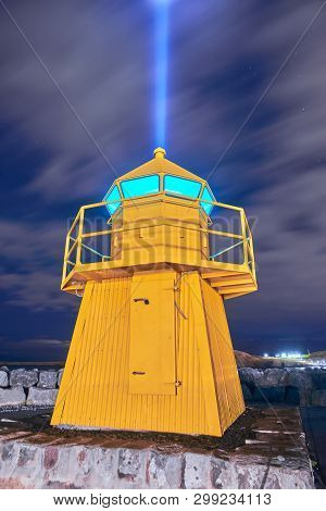 Lighthouse And Imagine Peace Tower On Videy Island In Reykjavik At Night