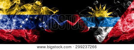 Venezuela Vs Antigua And Barbuda Smoky Mystic Flags Placed Side By Side. Thick Colored Silky Smoke F
