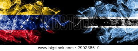 Venezuela Vs Botswana, Botswanan Smoky Mystic Flags Placed Side By Side. Thick Colored Silky Smoke F