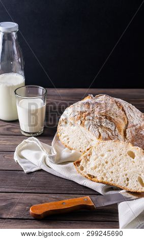Freshly Baked Bread With Milk Rustic Composition On A Black Background