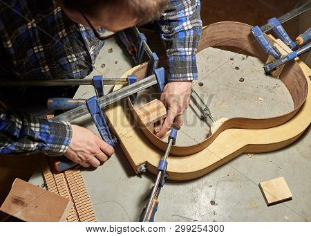 The Process Of Making A Classical Guitar. Adhering Tailblock And Neckblock Guitars.