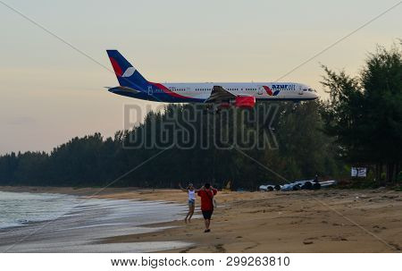 Airplane Flying Over The Sand Beach