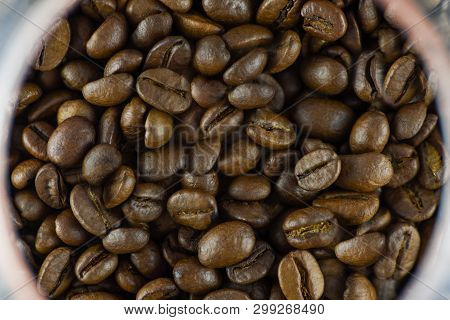 Close-up View Of Coffee Beans In A Glass Glass Glass. Horizontal Photography