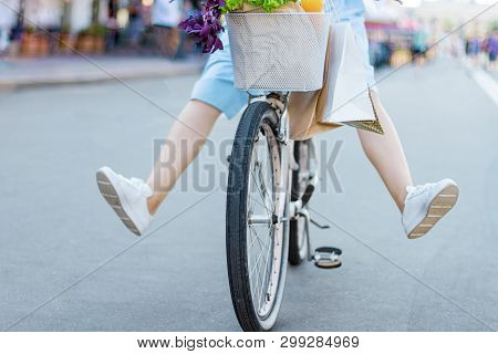 Woman Girl Dressed Stylish Retro Pin Up Cloth Dress, Cycling Riding Bicycle With Basket Of Flowers. 