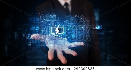 Elegant hand holding battery with full of energy