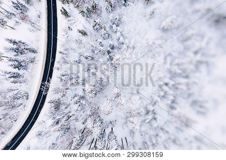 Aerial View Of Winter Beautiful Landscape Road With Trees Covered With Hoarfrost And Snow. Winter Sc