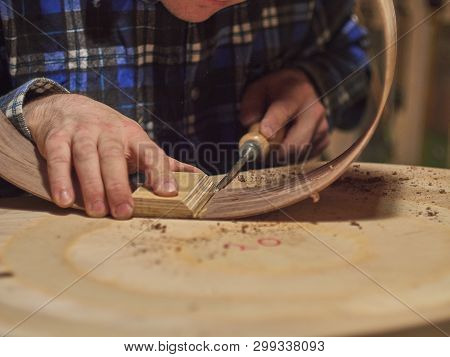 The Process Of Making A Classical Guitar. Remove Excess Glue After Gluing The Tailblock.