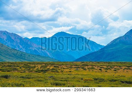 Spectacular View Of Giant Mountains Under Cloudy Sky. Huge Mountain Range At Overcast Weather. Wonde