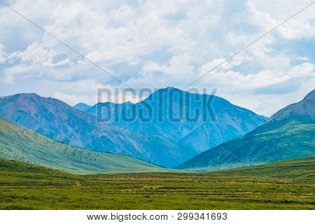 Spectacular View Of Giant Mountains Under Cloudy Sky. Huge Mountain Range At Overcast Weather. Wonde