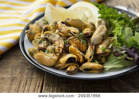 Peeled Mussels With Fresh Lemom. Healthy Seafood, Natural Sunlight Wooden Rustic Table