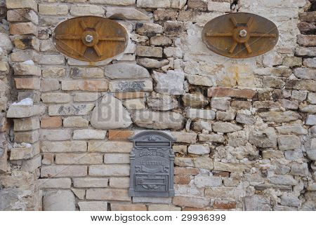 post box inside an old wall