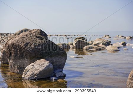 Stones Balance On The Beach. Place On Latvian Coasts Called Veczemju Klintis