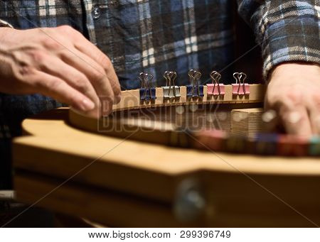 Glue Lining To The Side Of The Guitar. The Process Of Making A Classical Guitar.