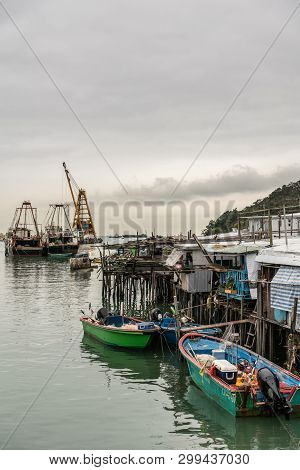 Hong Kong, China - March 7, 2019: Tai O Fishing Village. Modern Larger Fishing Vessels Docked In Por