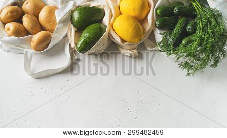 Zero Waste Concept. Textile Ecologiical Shopping Bags With Fruits And Vegetables On White Background