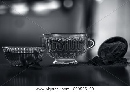 Ayurvedic Herb Brahmi Or Waterhyssop With Its Tea  In A Small Transparent Glass Bottle Along With It