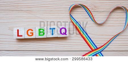 Lgbtq Text With Heart Shape Rainbow Ribbon For Lesbian, Gay, Bisexual, Transgender And Queer Communi
