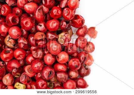Lot Of Whole Peruvian Pink Pepper On The Left Side Flatlay Isolated On White Background