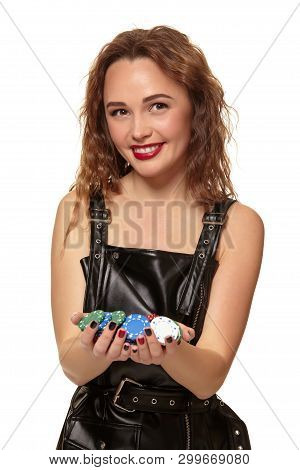 Casino Concept. Portrait Of Young Pretty Caucasian Woman, Playing In Casino. Roulette, Poker Chips, 