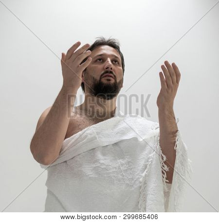 Muslim pilgrim with Hajj clothes