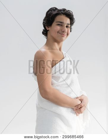 Teenage boy wearing Ehram for Hajj