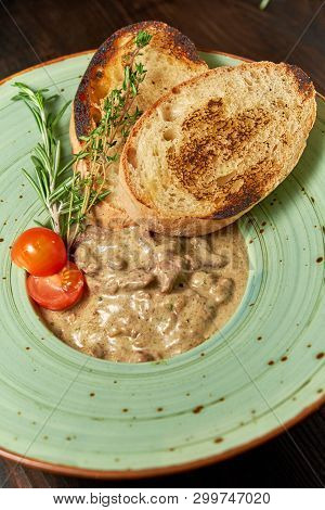 Beef Stroganoff With Croutons. Dark Wooden Background. Restaurant Menu