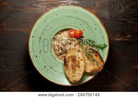 Beef Stroganoff With Croutons. Dark Wooden Background. Restaurant Menu