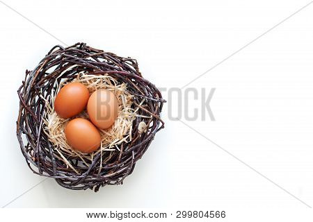 Easter! Chicken Eggs In A Nest With Branches, Agriculture.
Easter Eggs On The Table In The Nest.
Bei
