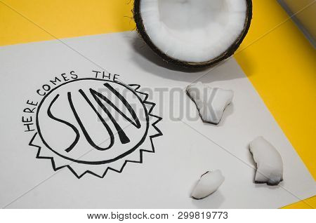Hello Summer Concept.  A White Paper Where Is Wtitten With Nice Handwriting - Here Comes The Sun. Su