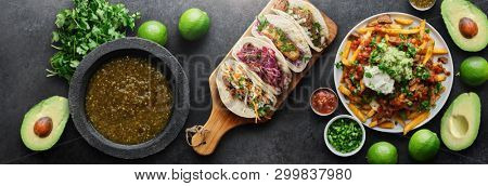 mexican tacos and carne asada fries in panoramic wide composition from birds eye view