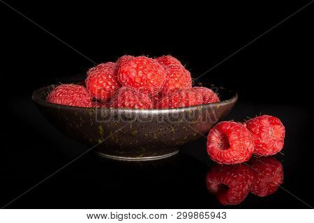 Lot Of Whole Sweet Fresh Red Raspberry On Grey Ceramic Plate Isolated On Black Glass