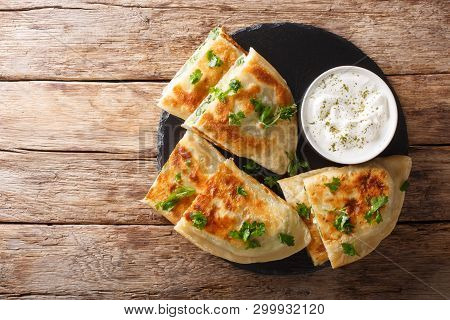 Bolani Flat-bread From Afghanistan, Baked Or Fried With A Vegetable Filling And Served With Plain Yo